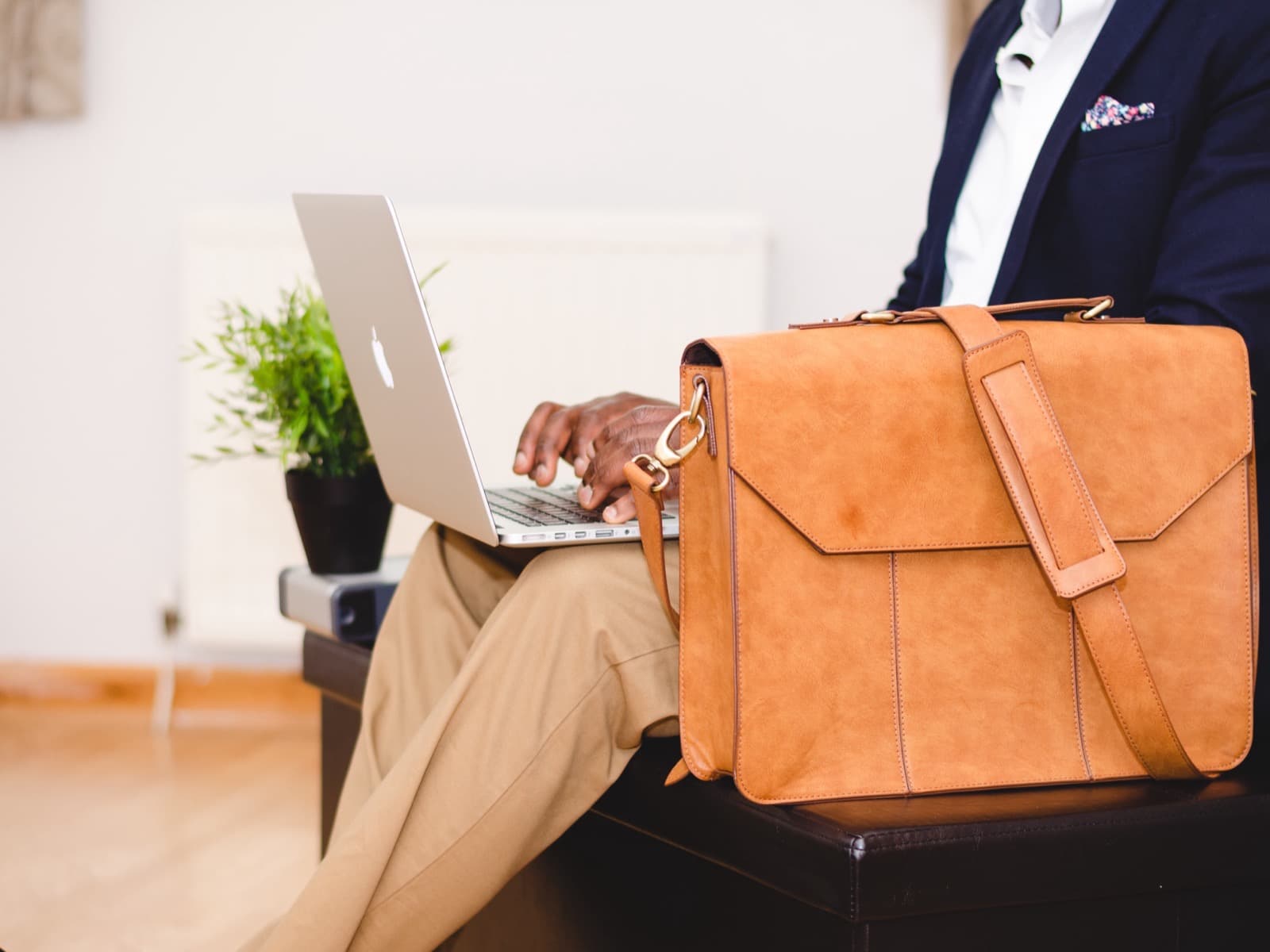 African businessman managing ad campaigns on his laptop
