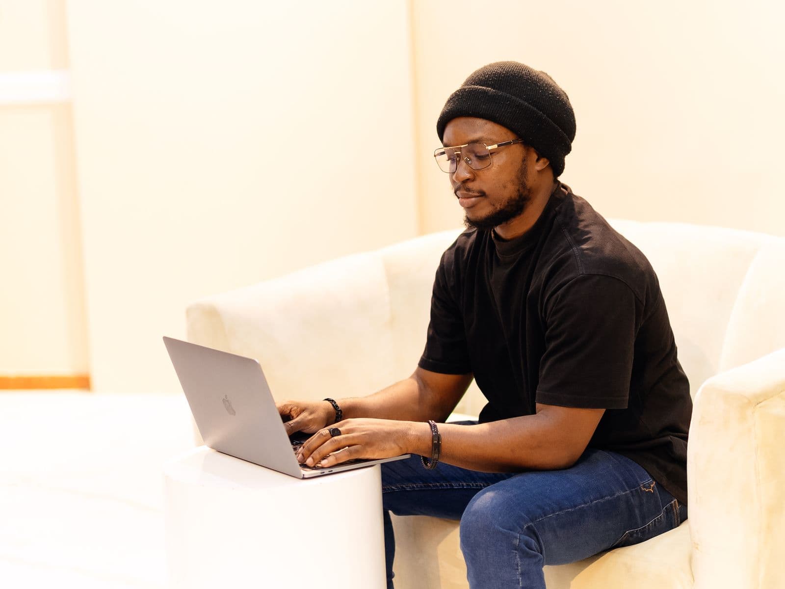 African developer working on a laptop in a Lagos workspace