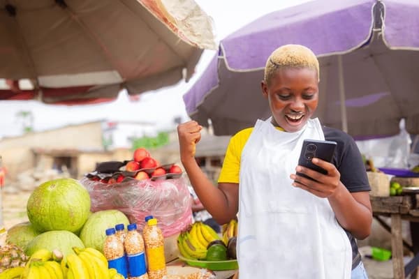 African market vendor reaching customers through Adscod